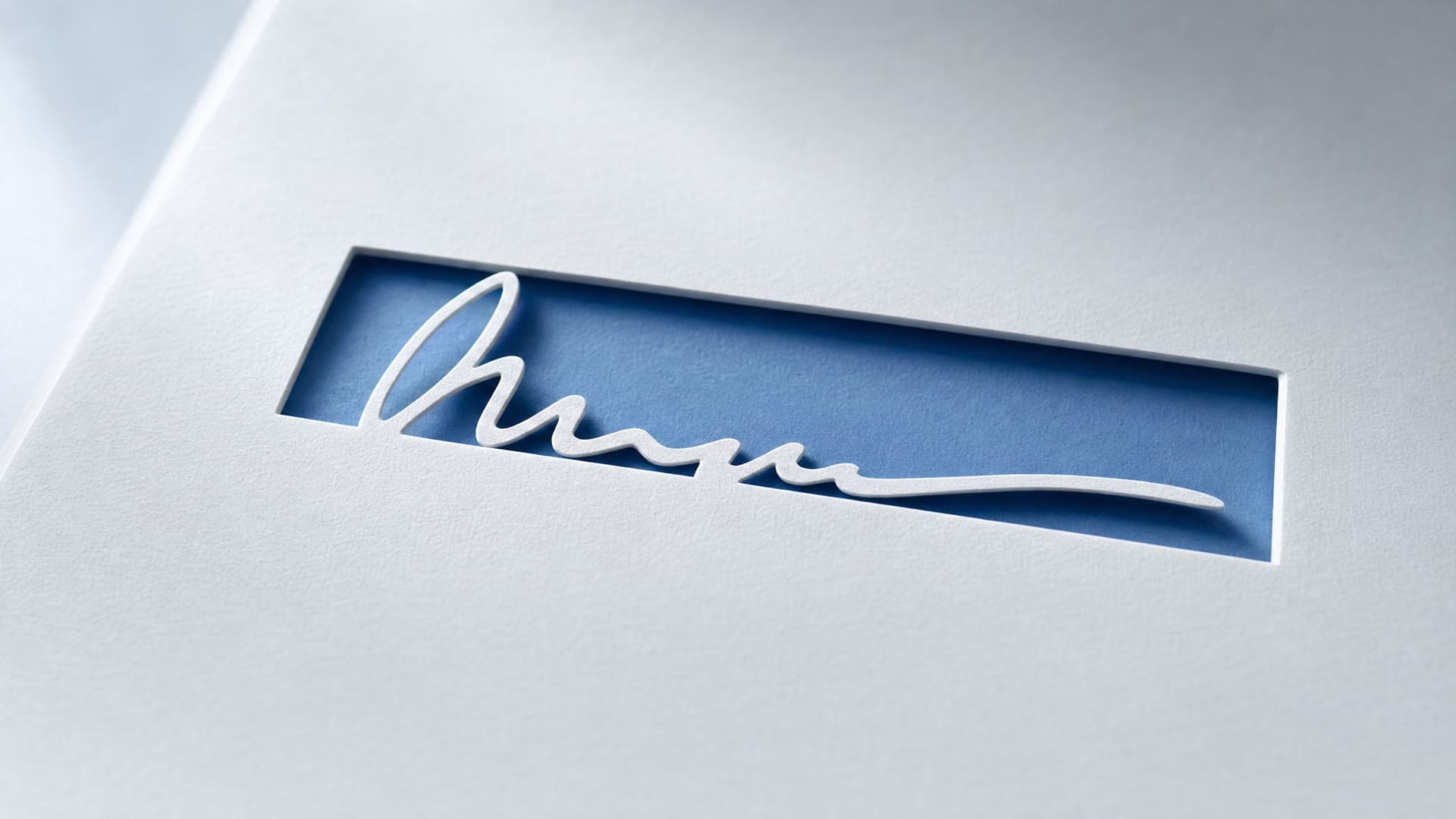 A torn signature line on paper, blue ink.